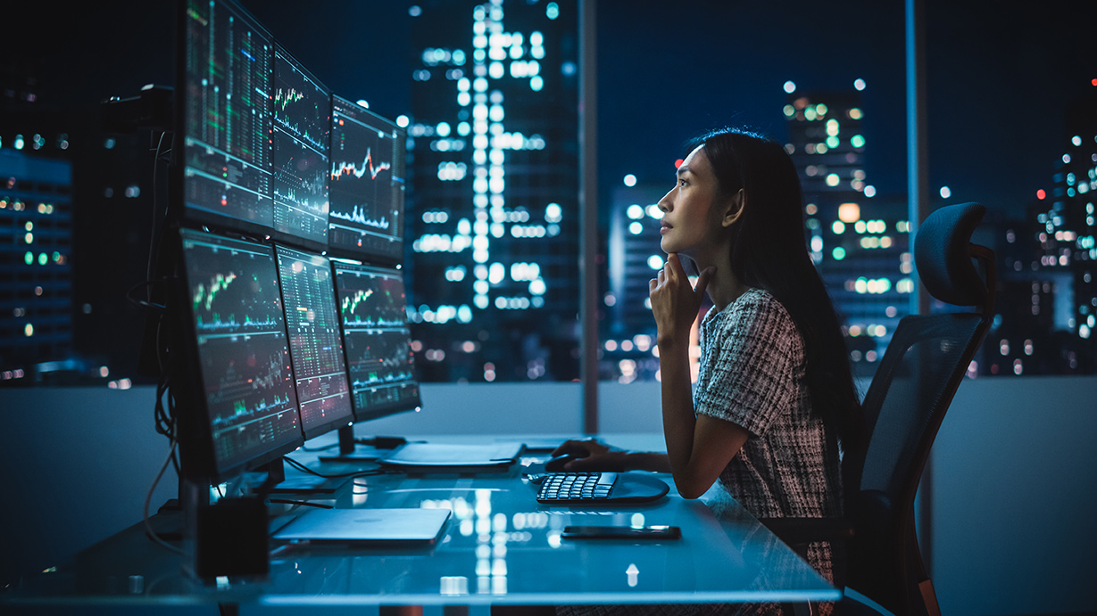 Woman working in an office at night